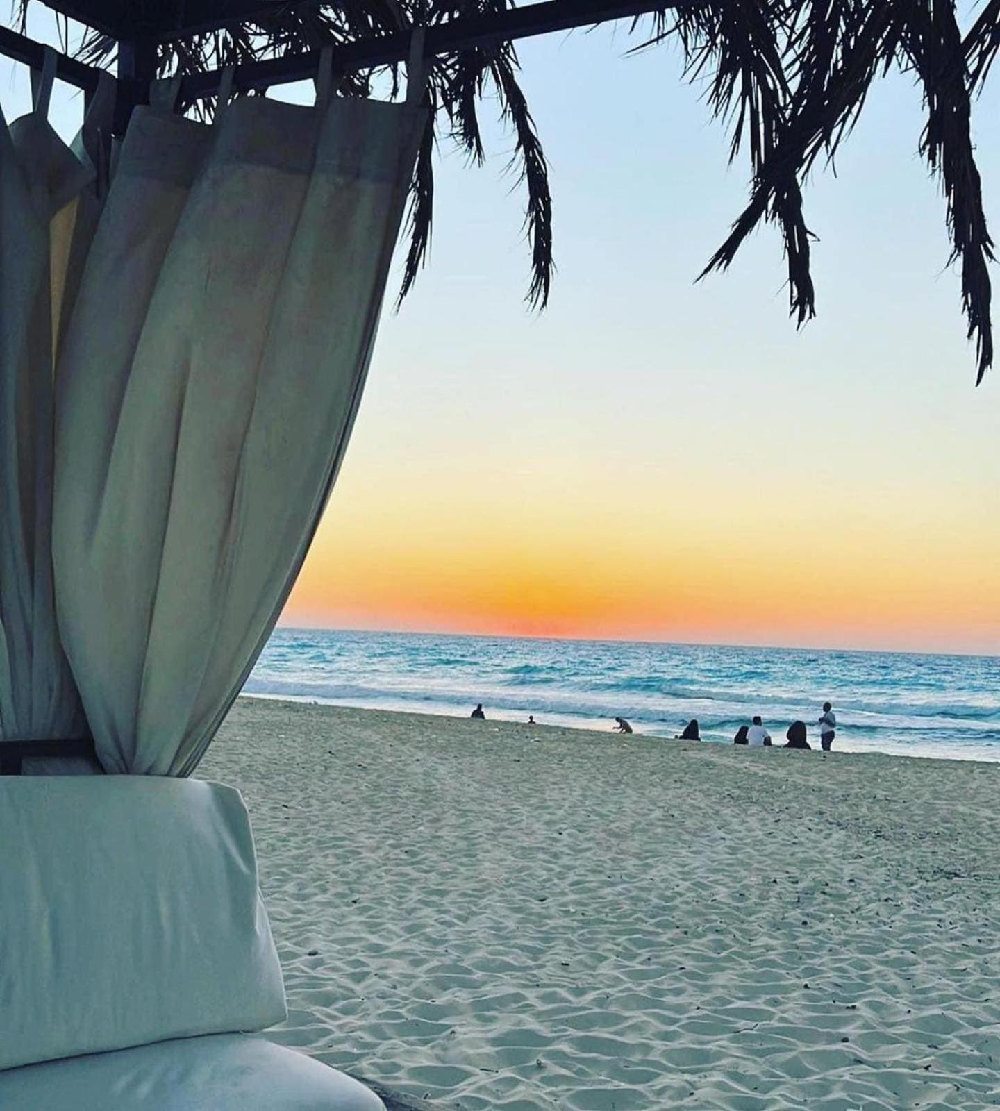 Borg El Arab Beach Resort Exteriör bild Sunset at the beach