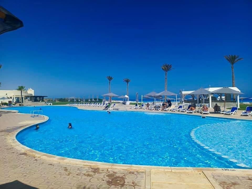 Borg El Arab Beach Resort Exteriör bild A swimming pool at a resort in Egypt