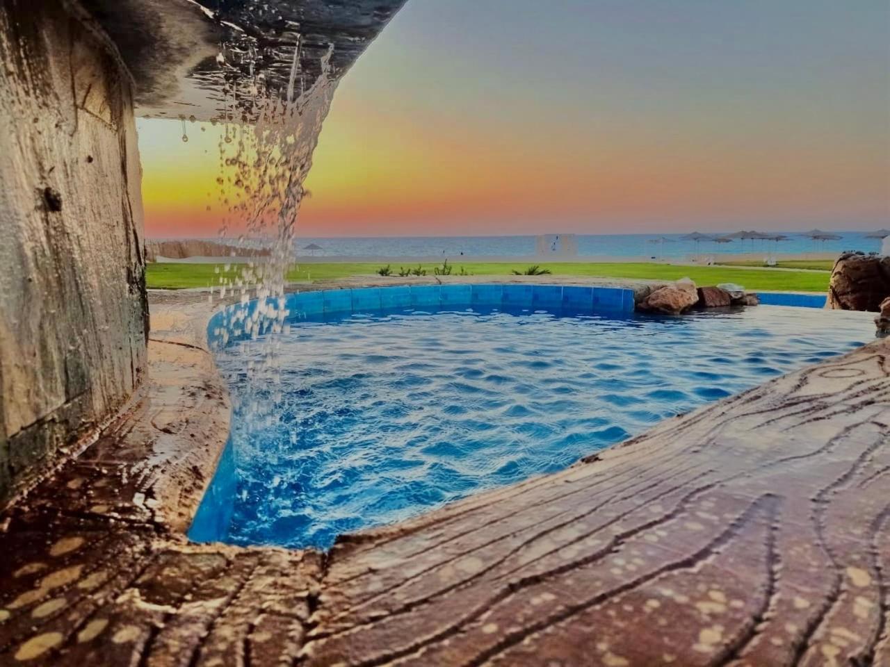 Borg El Arab Beach Resort Exteriör bild Sunset at the beach